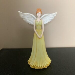 Yellow Angel Figurine with White Wings